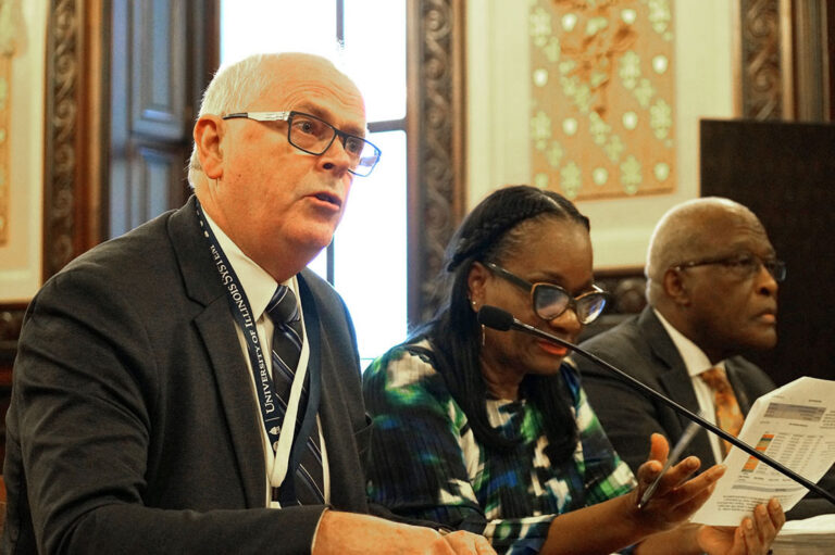 Nick Jones, left, executive vice president and vice president of academic affairs of the University of Illinois System, testifies before a Senate committee in opposition to a bill that would overhaul state funding of public universities.